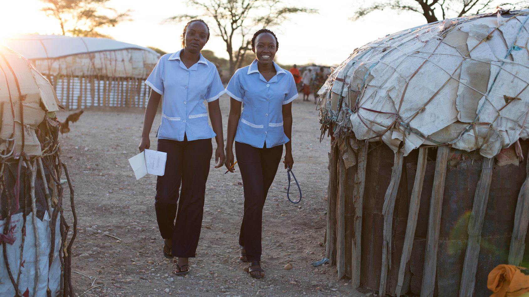 Two nurses working in rural village location. Kenya, Africa.